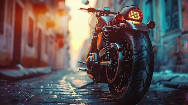 a-motorcycle-is-parked-on-a-wet-cobblestone-street-photo